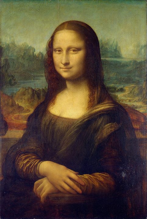 A woman with folded hands before a hazy landscape, her face modelled in soft shadow